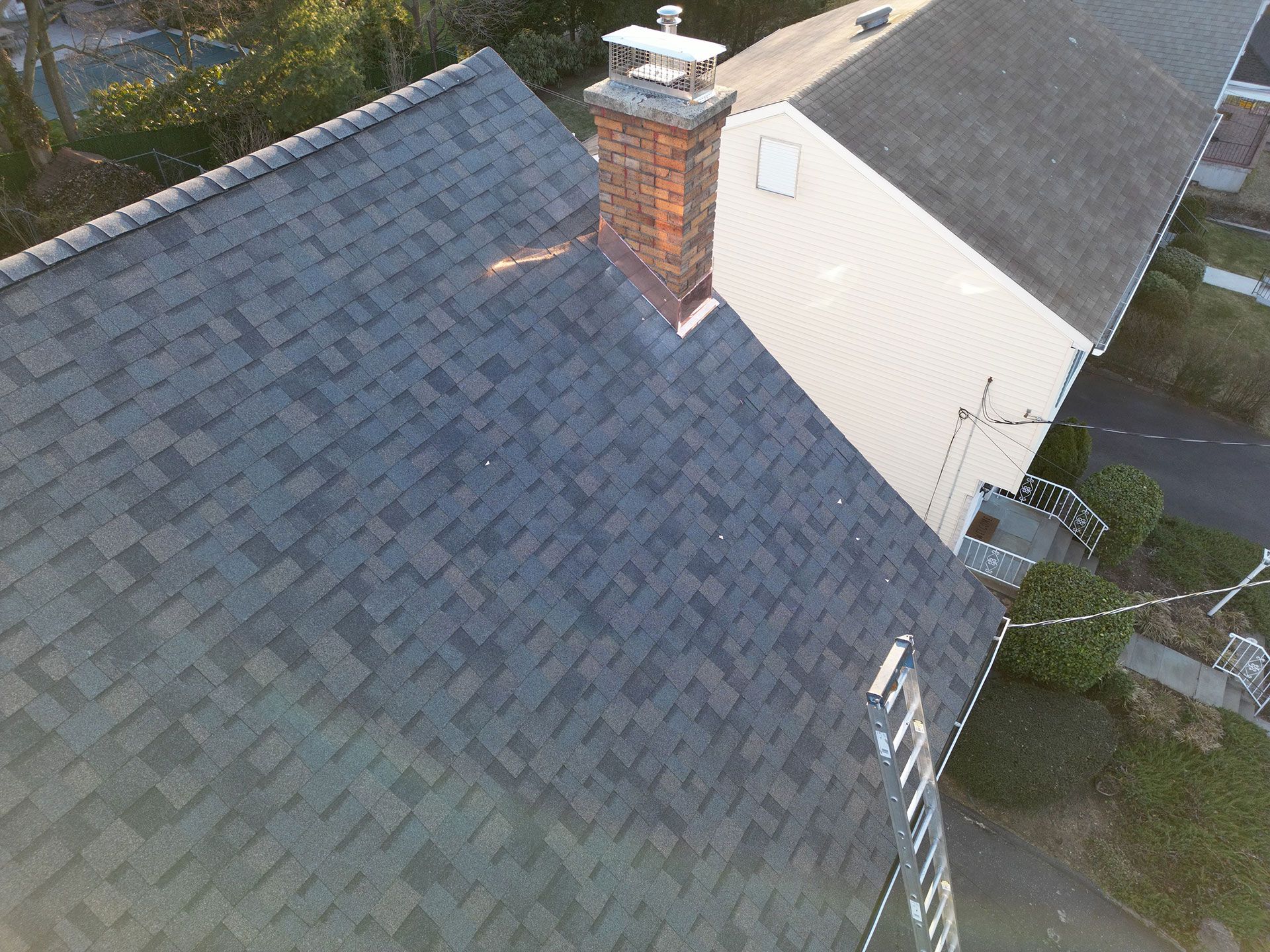 An aerial view of a house with a chimney on the roof