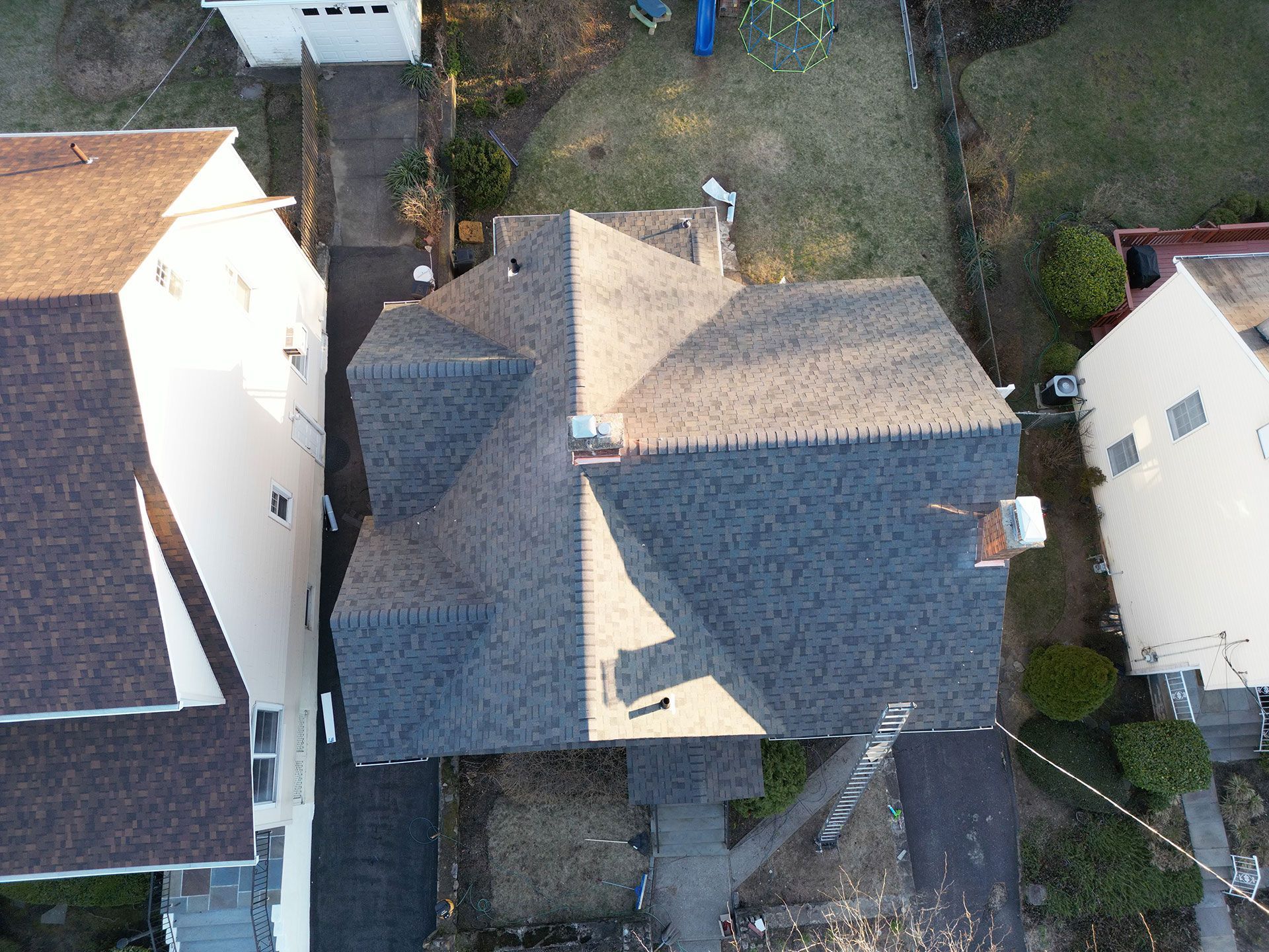An aerial view of a house with a new roof