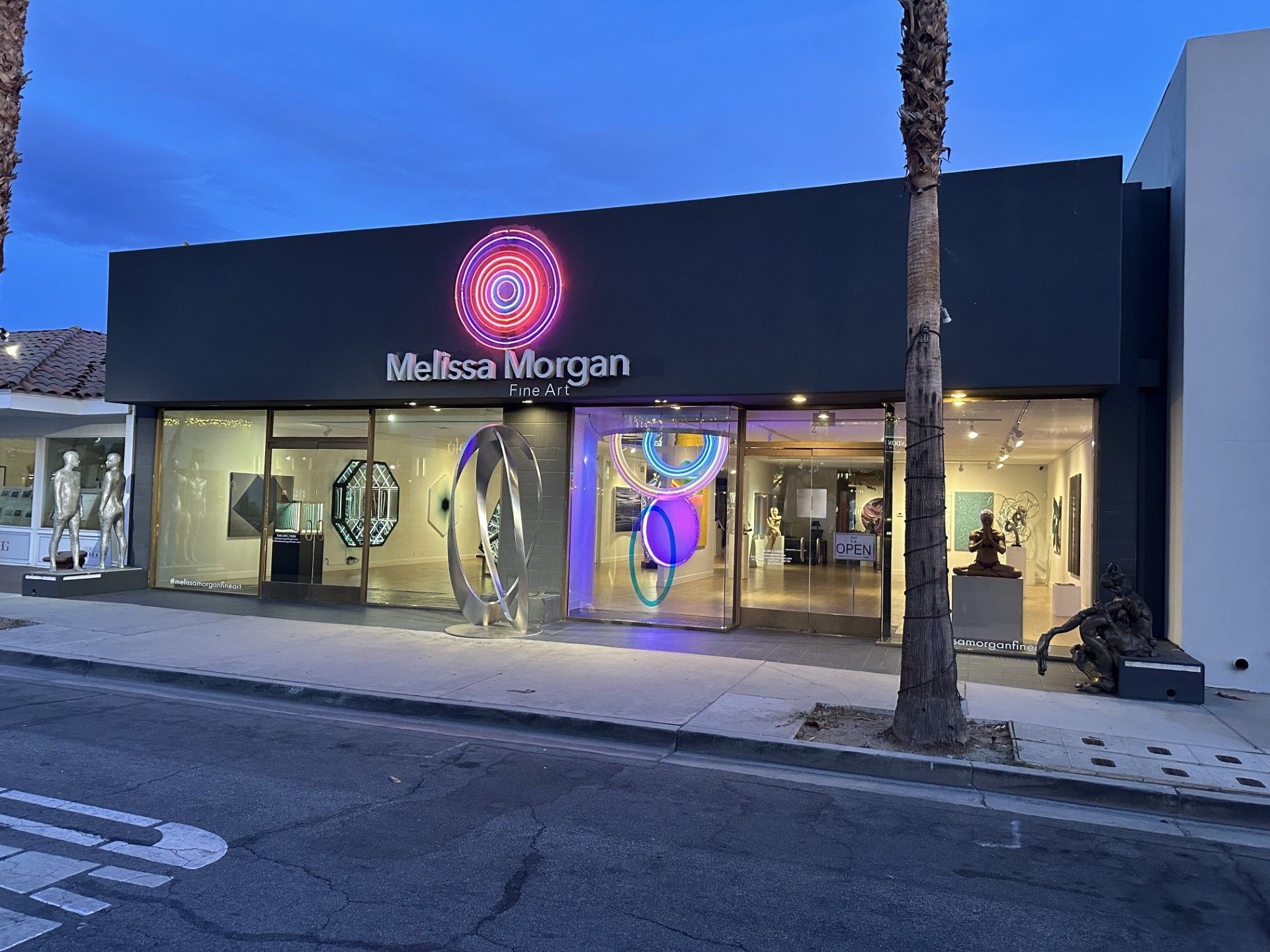 A Melissa Morgan store is lit up at night