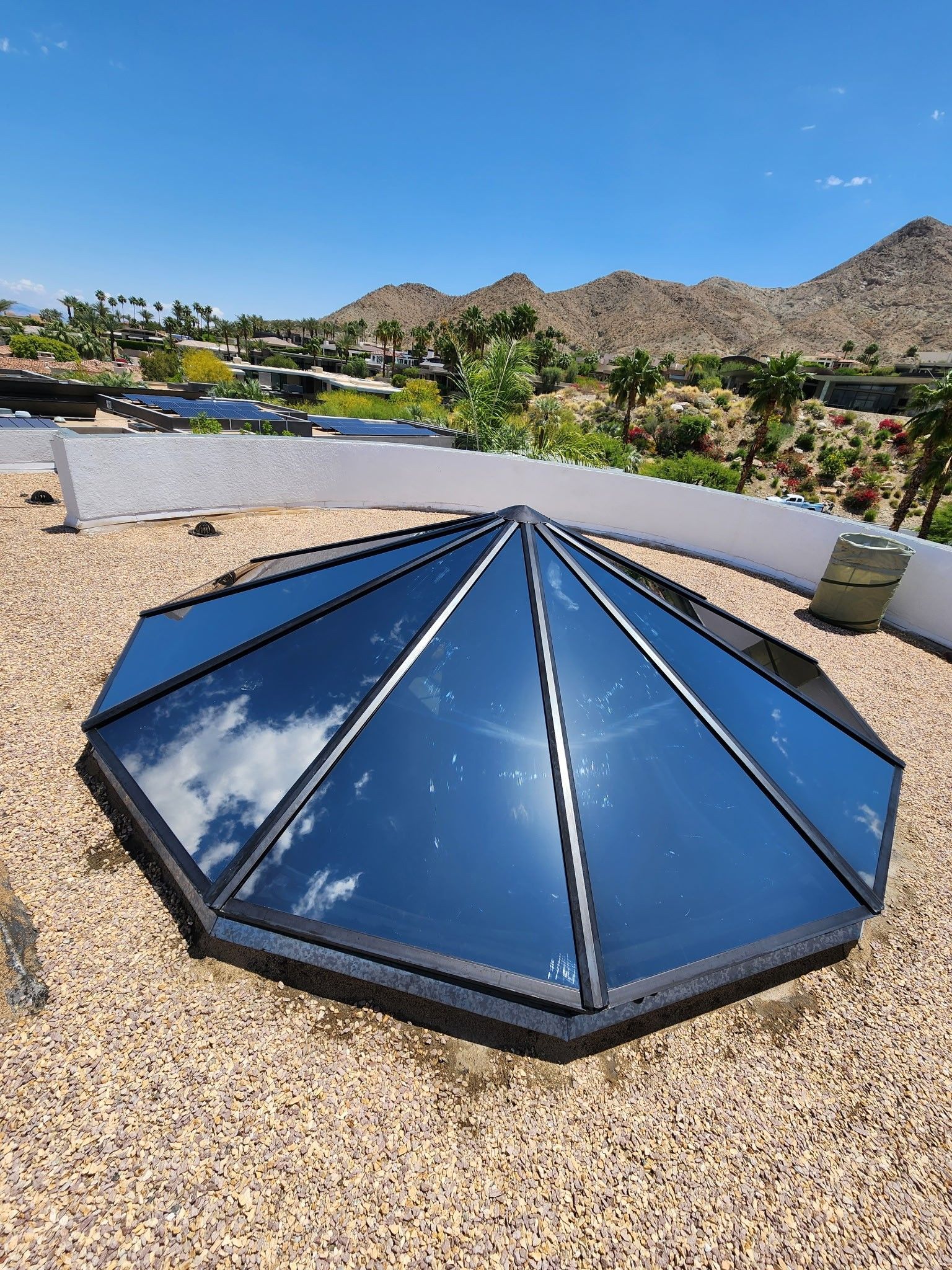 A pyramid shaped skylight on the roof of a building