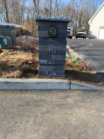 stone post with house number