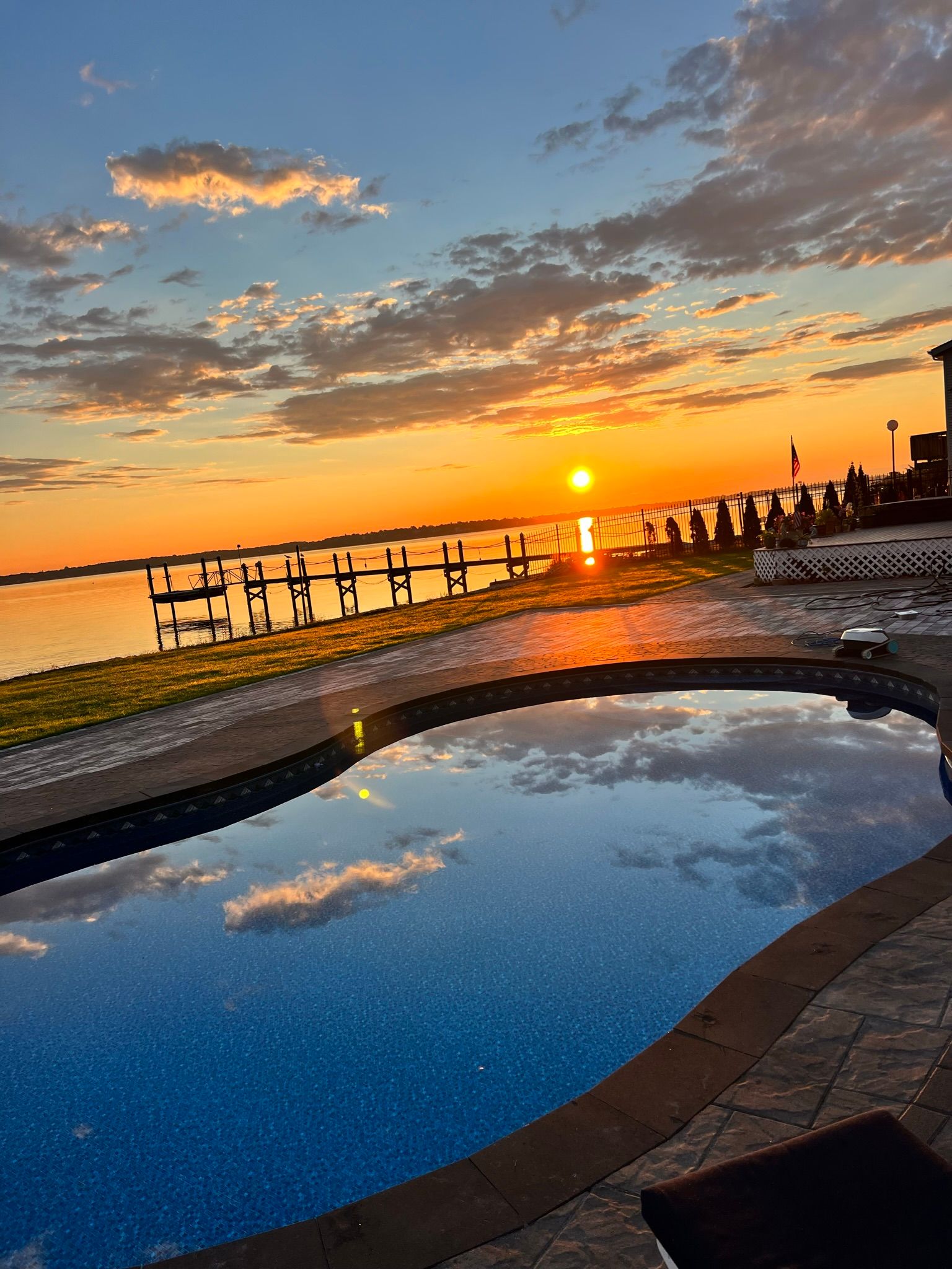pool deck with a view of the sunset