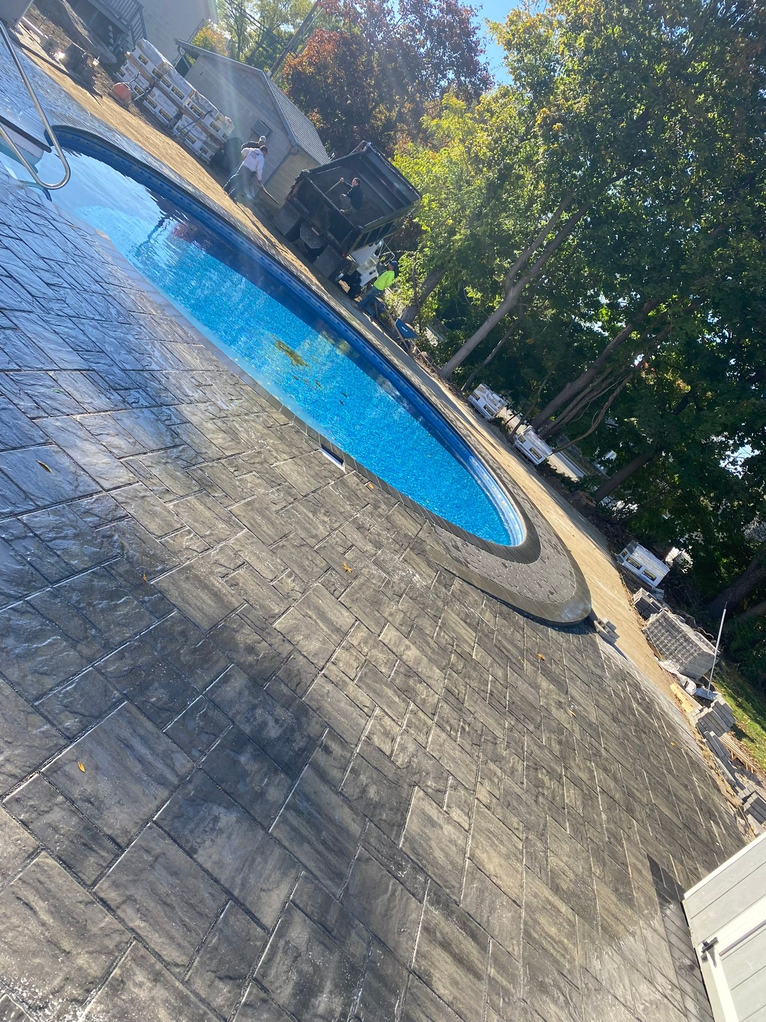 stoned pool deck with circular pool