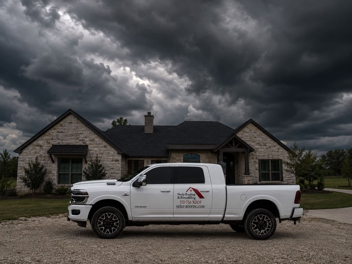 White pickup truck parked in front of a house under dark storm clouds