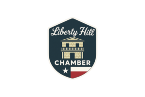 Liberty Hill Chamber logo on a dark shield with a building, white text, and a red and white star accent