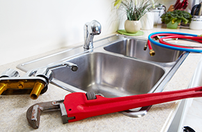 plumbing tools placed in a sink