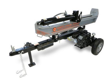 A log splitter is sitting on a trailer on a white background.