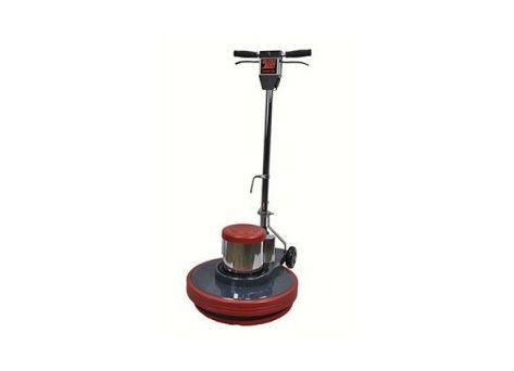 A floor polisher is sitting on a white surface.