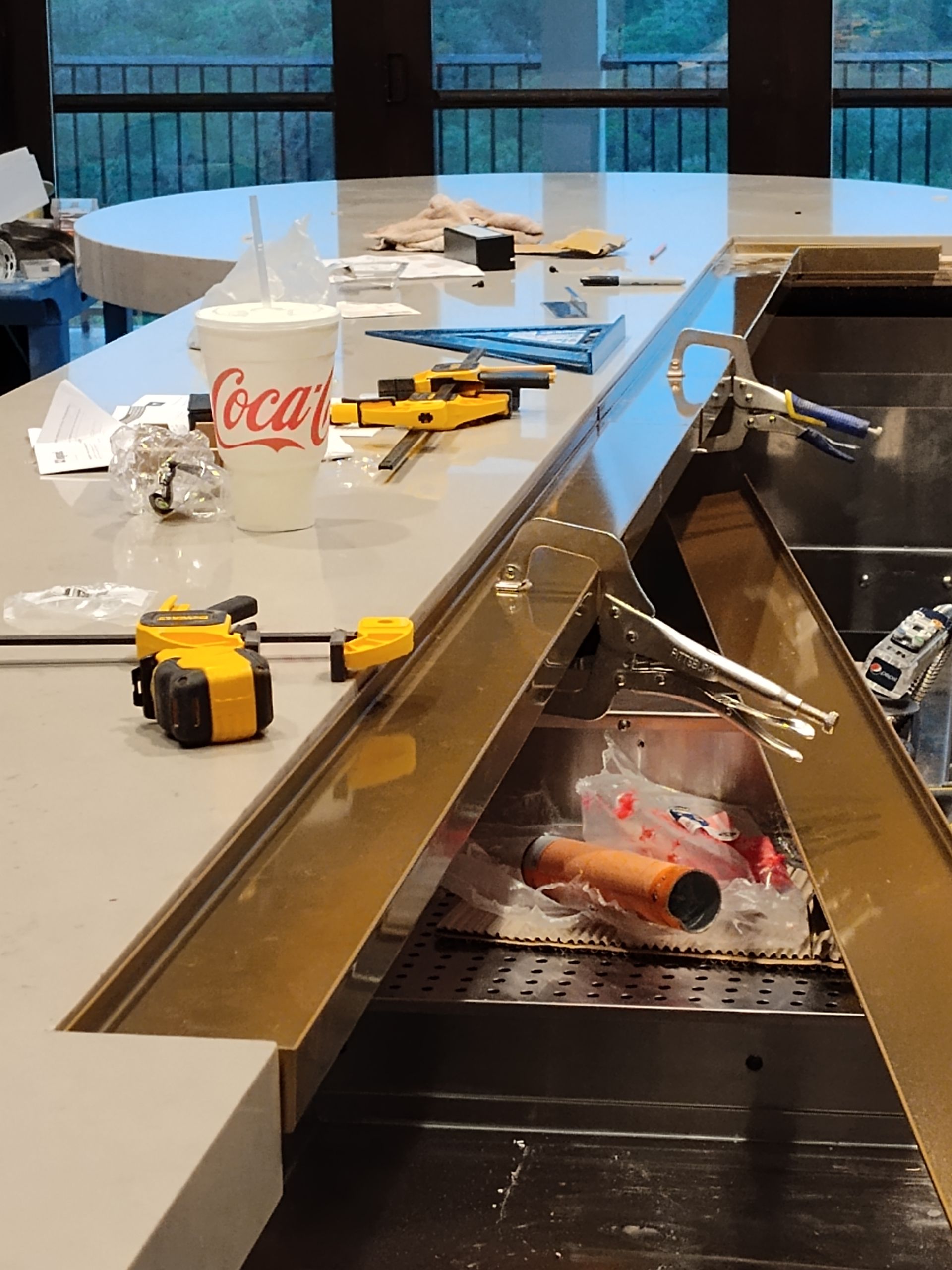 A bar is being built in a restaurant with a ladder in the background.