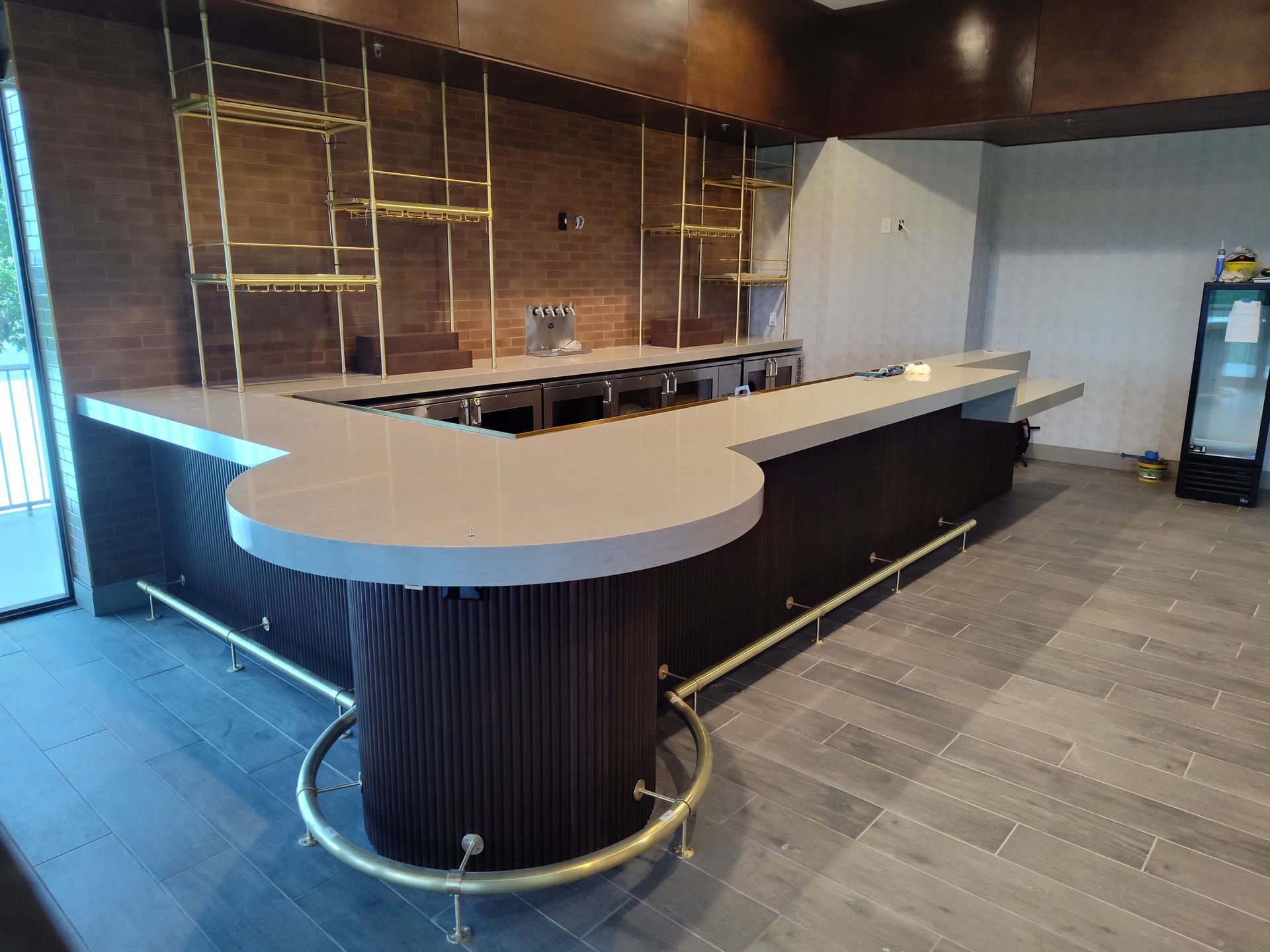 There is a long bar in the middle of the room.