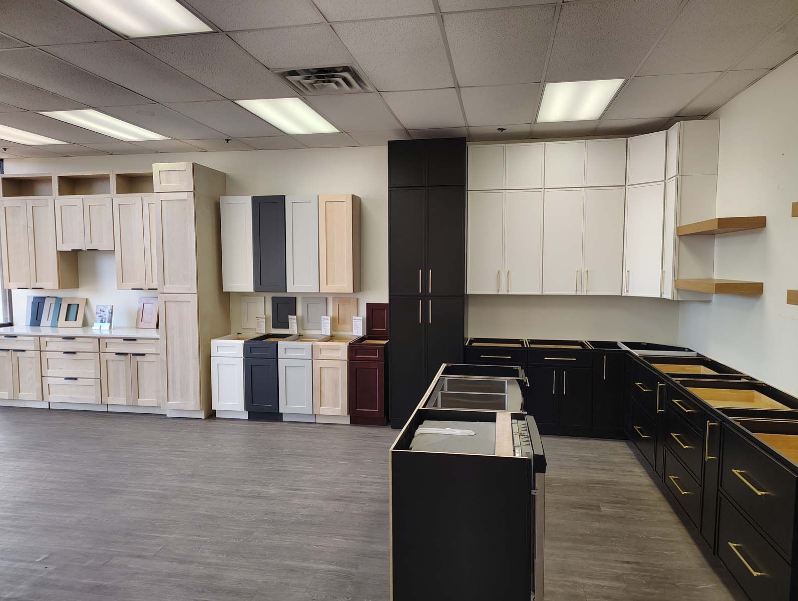 A kitchen with a lot of cabinets and a stove