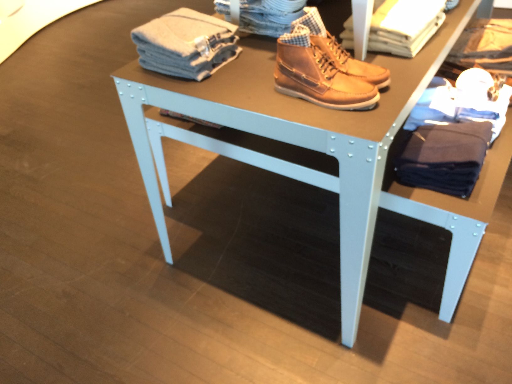 A table with a pair of shoes on top of it.