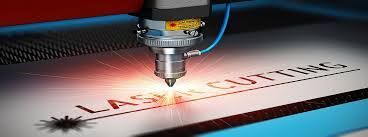 A machine is cutting a piece of paper with a laser.