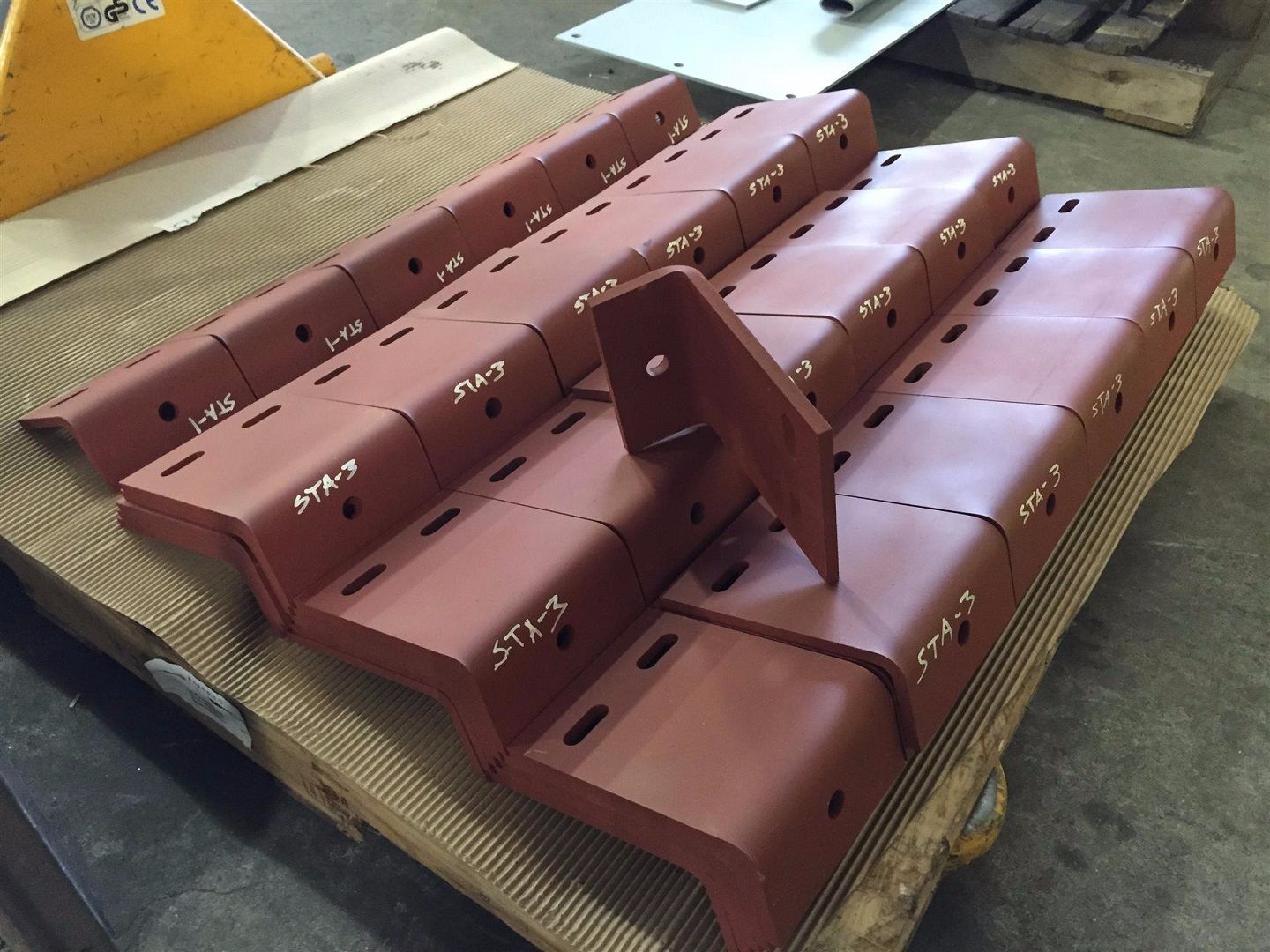 A bunch of pieces of metal are stacked on top of each other.