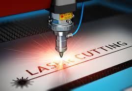 A machine is cutting a piece of paper with a laser.