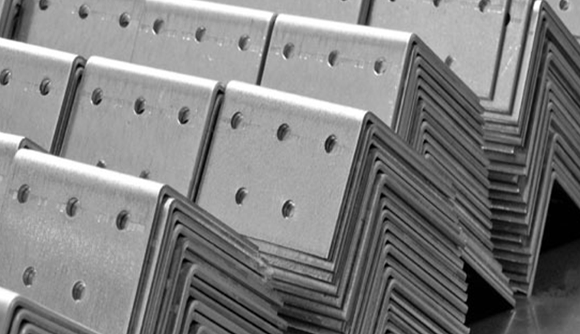 A stack of metal brackets sitting on top of each other on a table.