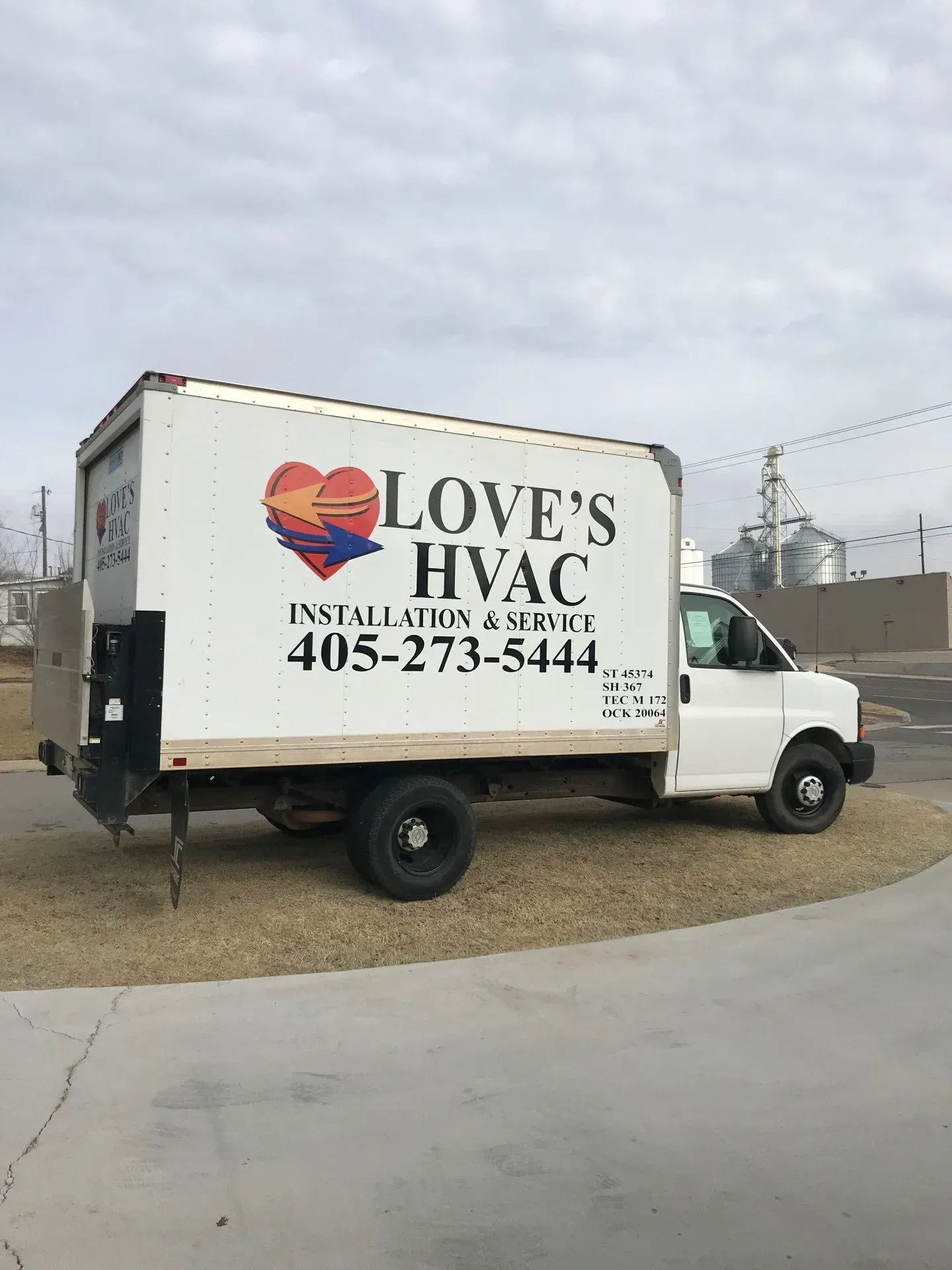 White Love’s HVAC service truck parked outdoors on a cloudy day