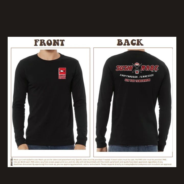 A man is wearing a black long sleeve shirt with a logo on the front and back