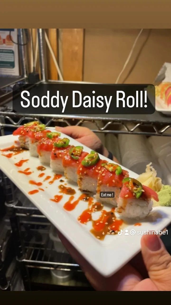A person is holding a plate of soddy daisy roll