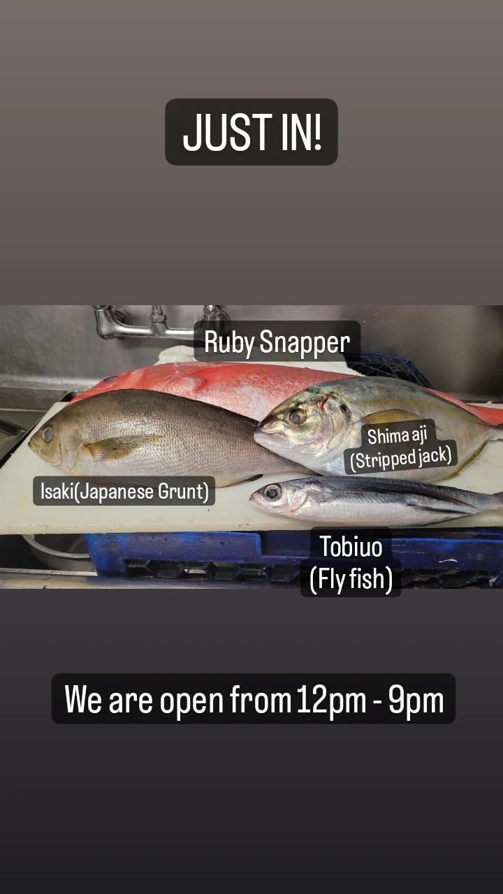 A bunch of fish are sitting on top of a cutting board.