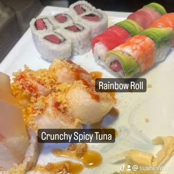 A plate of sushi including crunchy spicy tuna and rainbow roll