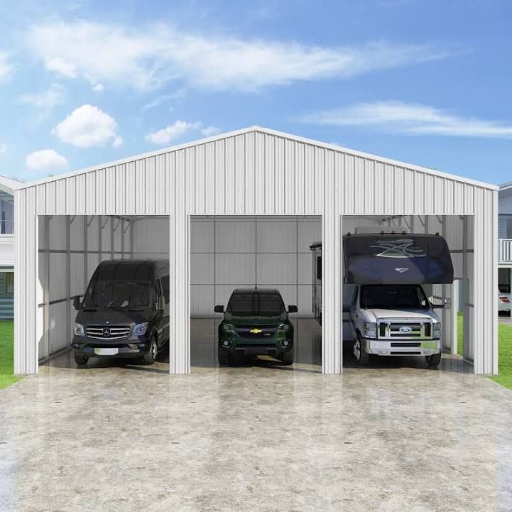 three cars and a truck are parked in a garage