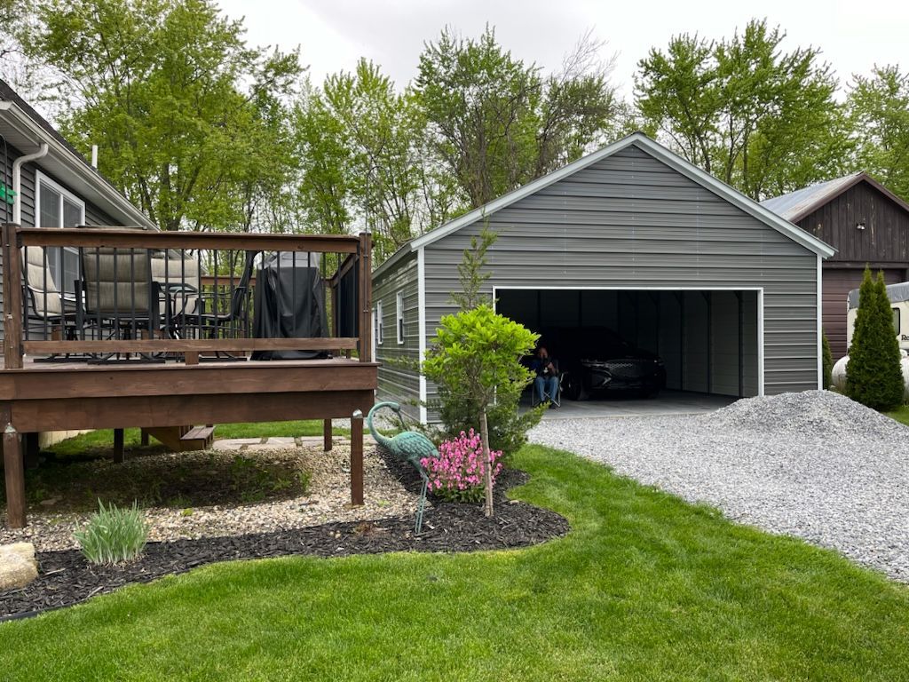 A garage next to a house with a deck