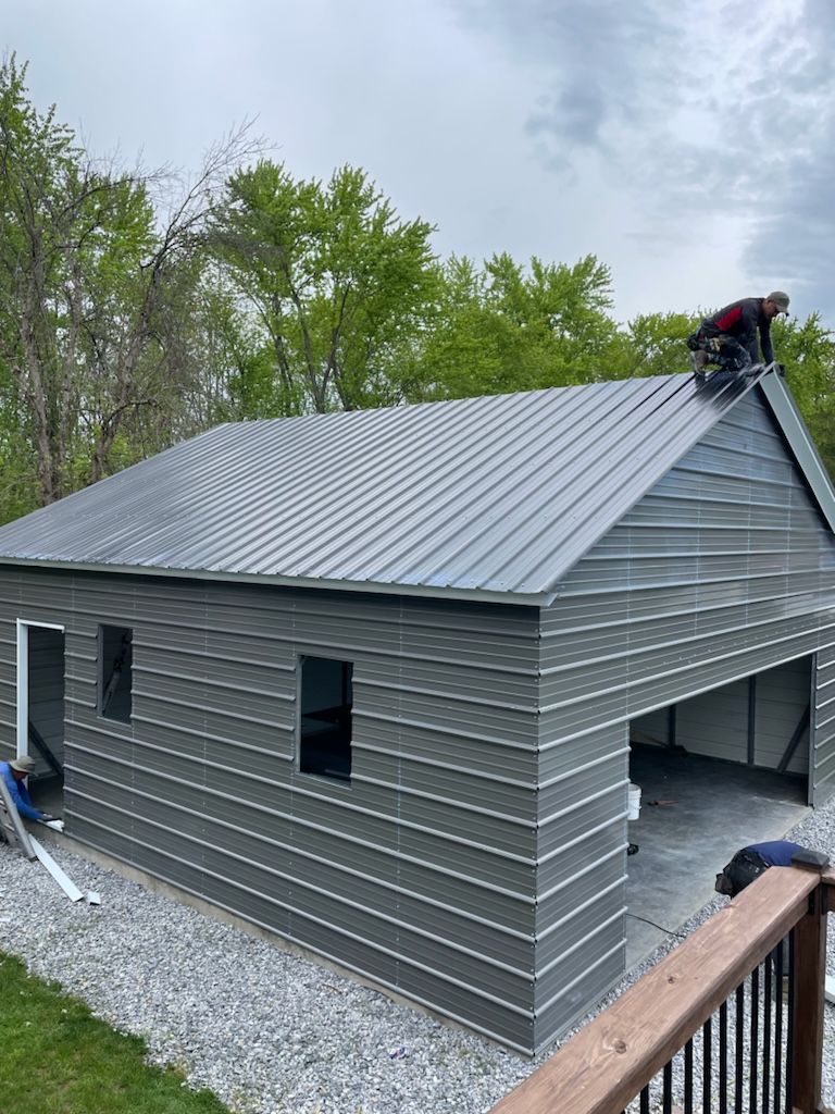 A man is working on the roof of a building