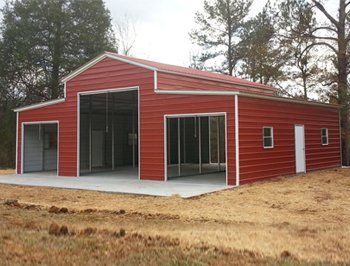 A large red metal barn