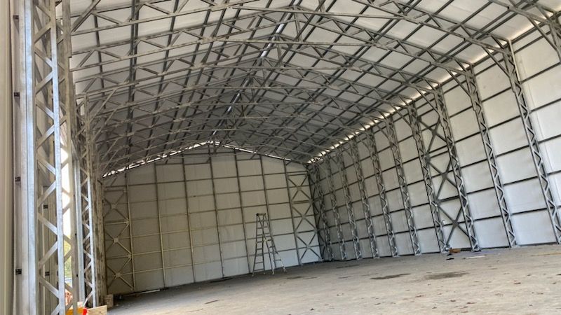 A large warehouse with a ladder