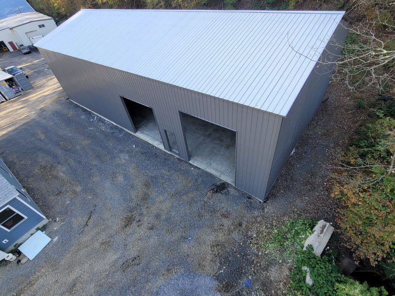 An aerial view of a large commercial metal commercial building