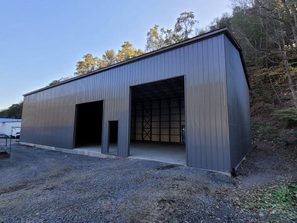 A large metal building with a large garage door