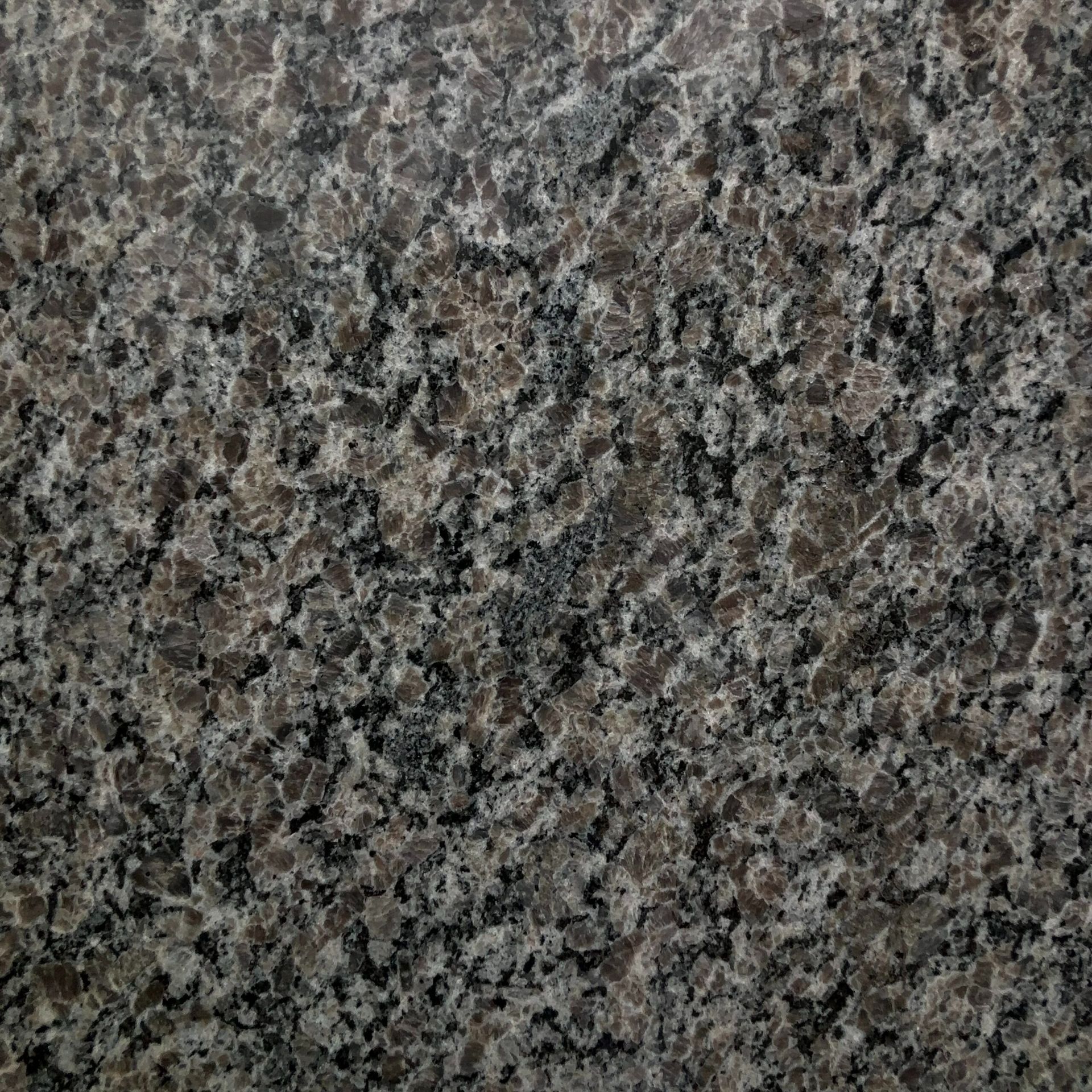 A close up of a gray granite counter top