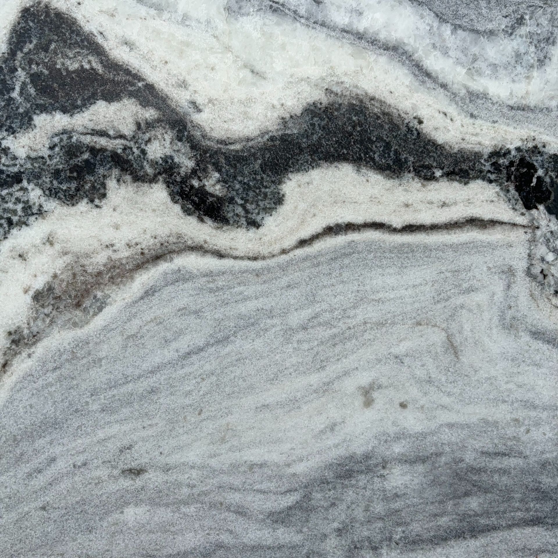 A close up of a black and white marble texture.