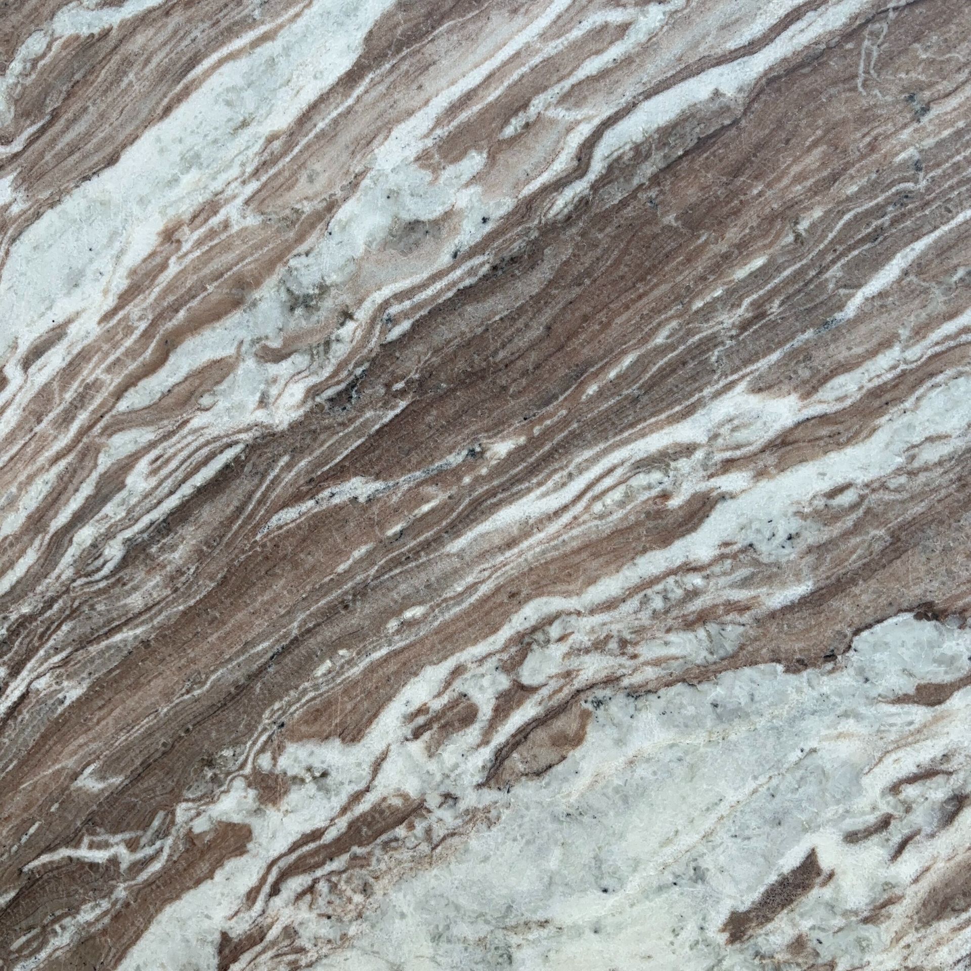 A close up of a brown and white marble texture