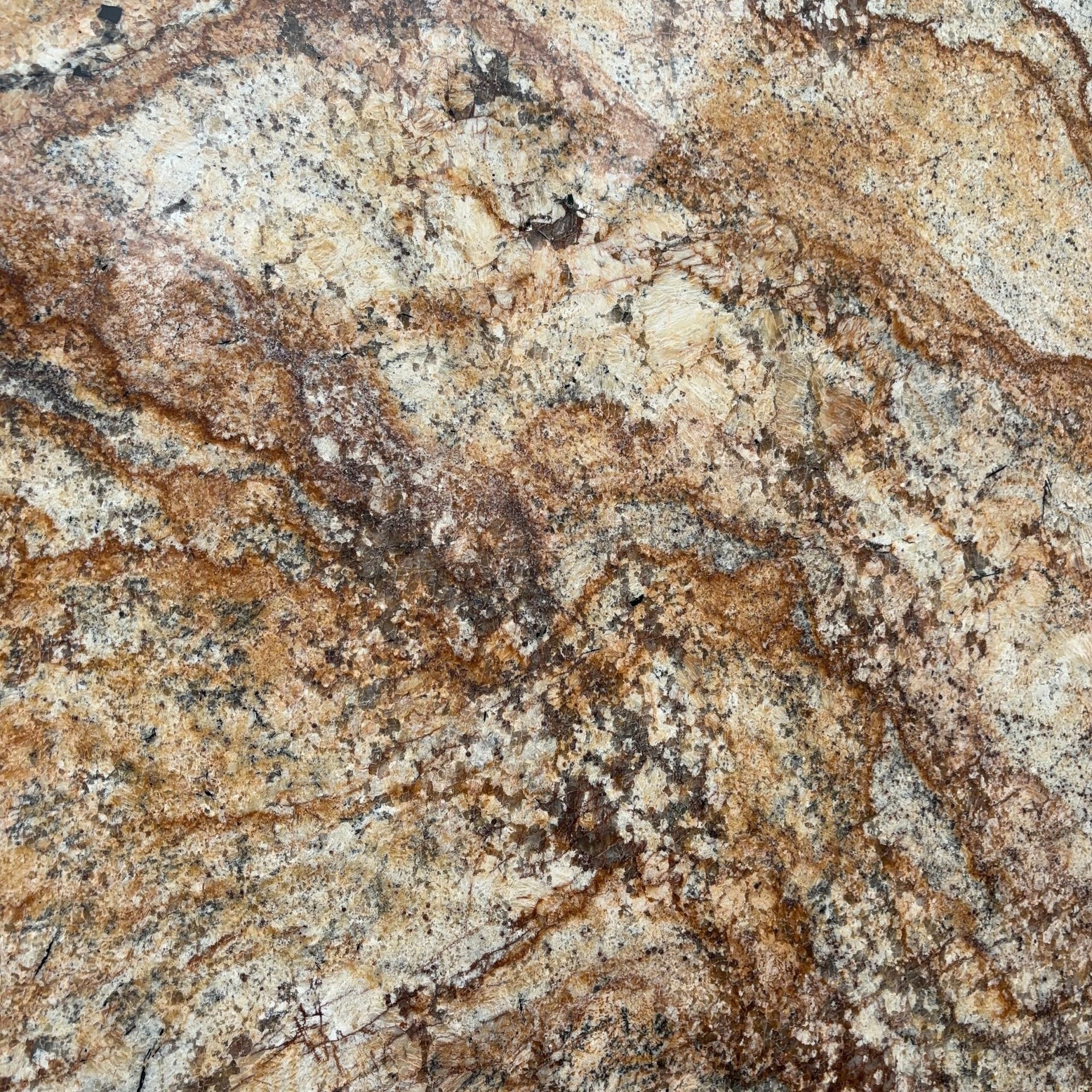 A close up of a granite counter top with a marble texture.