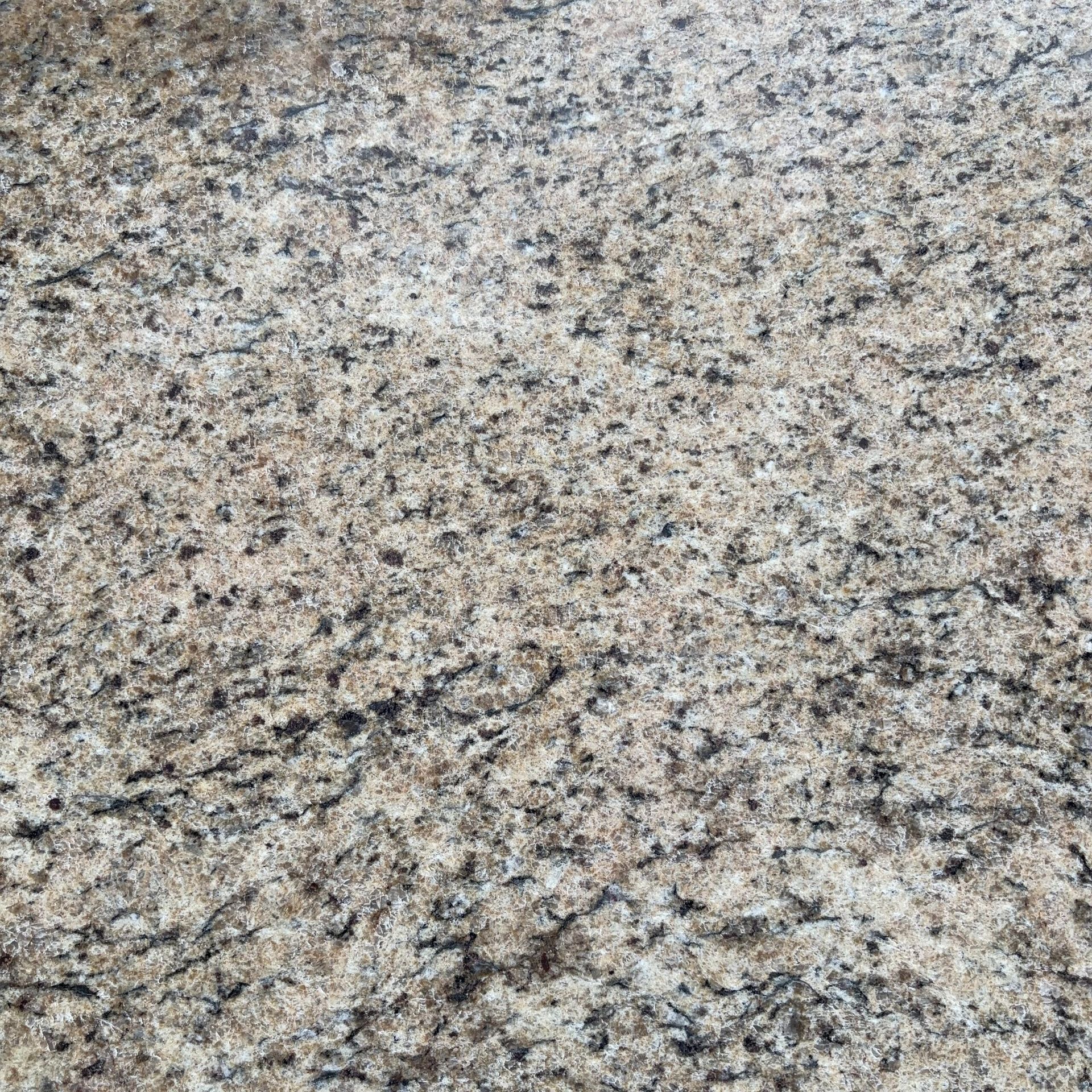 A close up of a granite counter top with a lot of small stones on it.