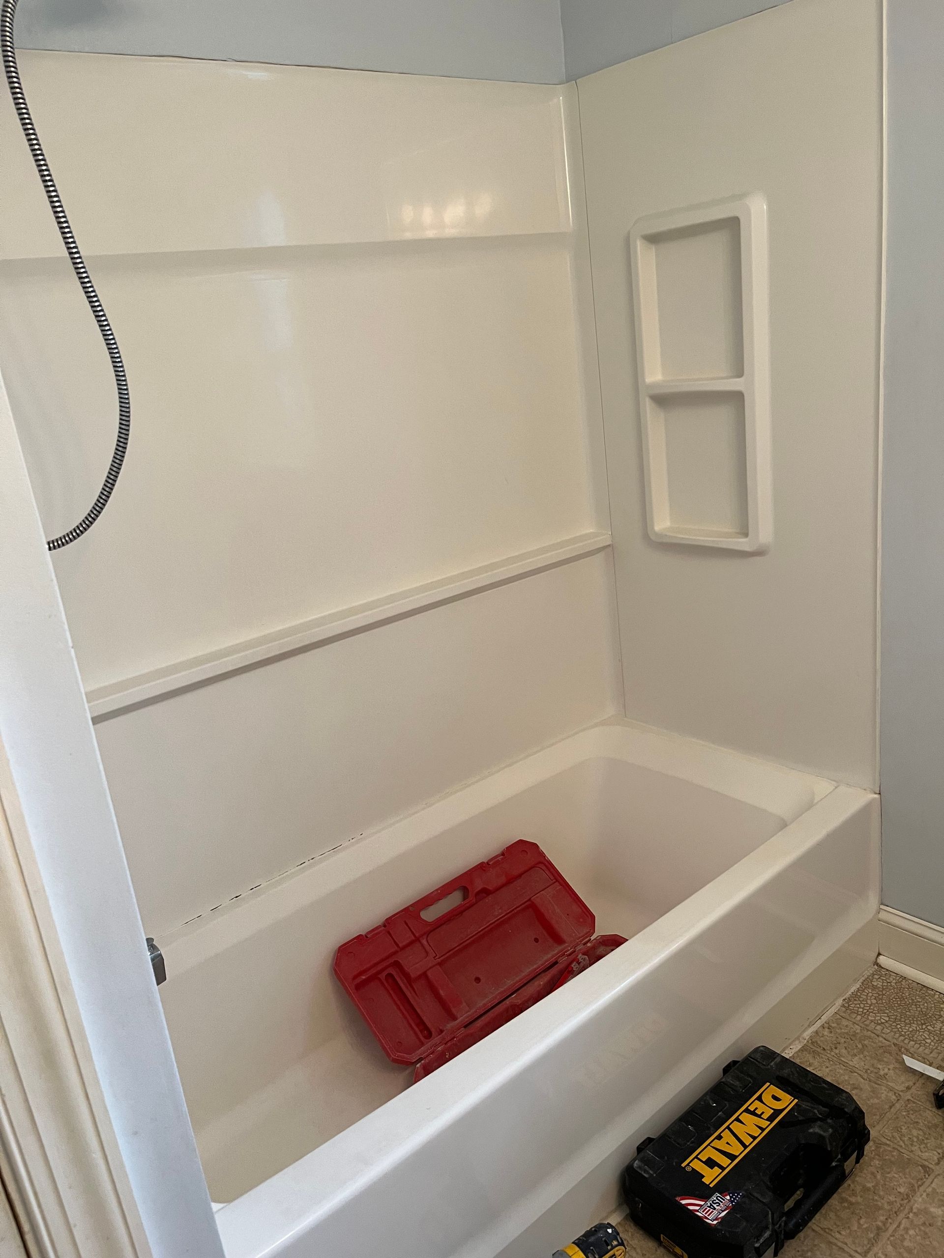 A bathtub with a dewalt toolbox in it