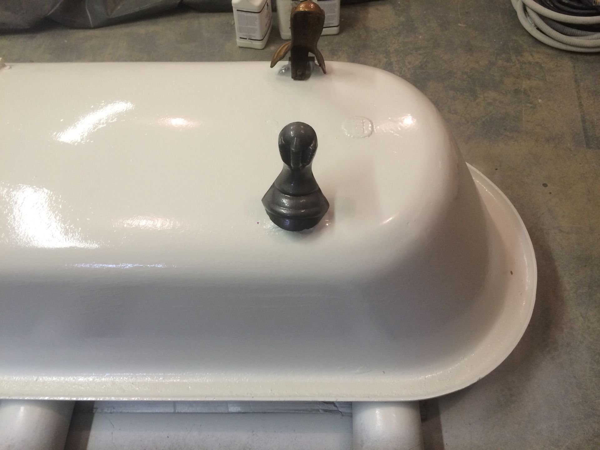 A white bathtub with a chess piece on top of it