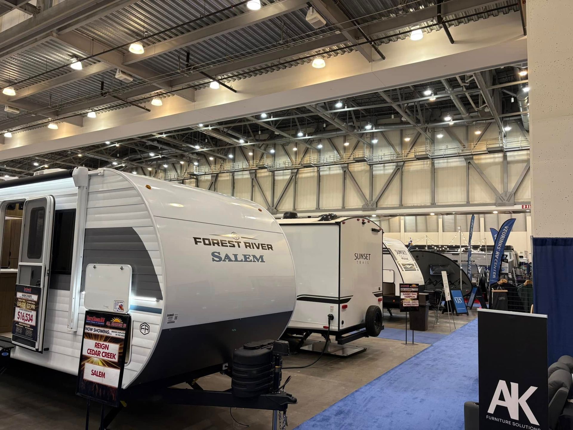 A trailer is on display at a rv show.