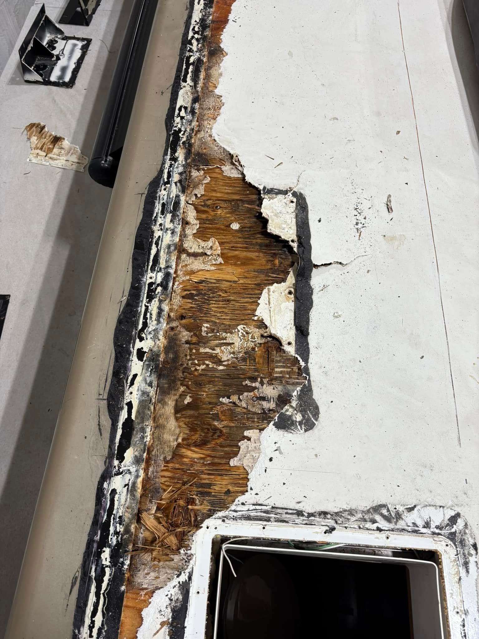 A close up of a roof with a hole in it.