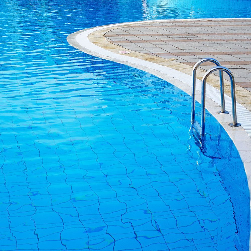 A swimming pool with a staircase leading to it