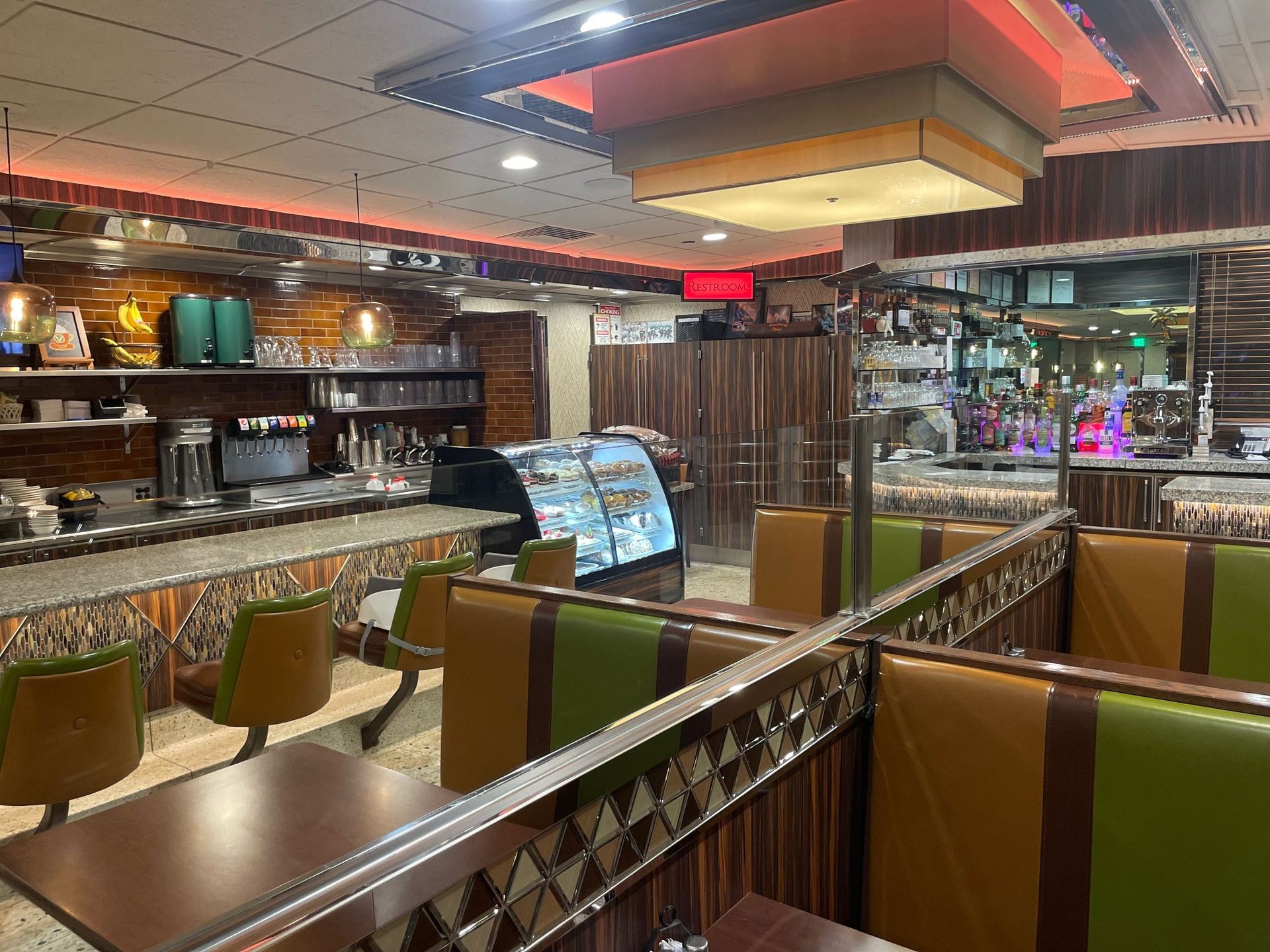 A diner with tables and chairs and a counter.