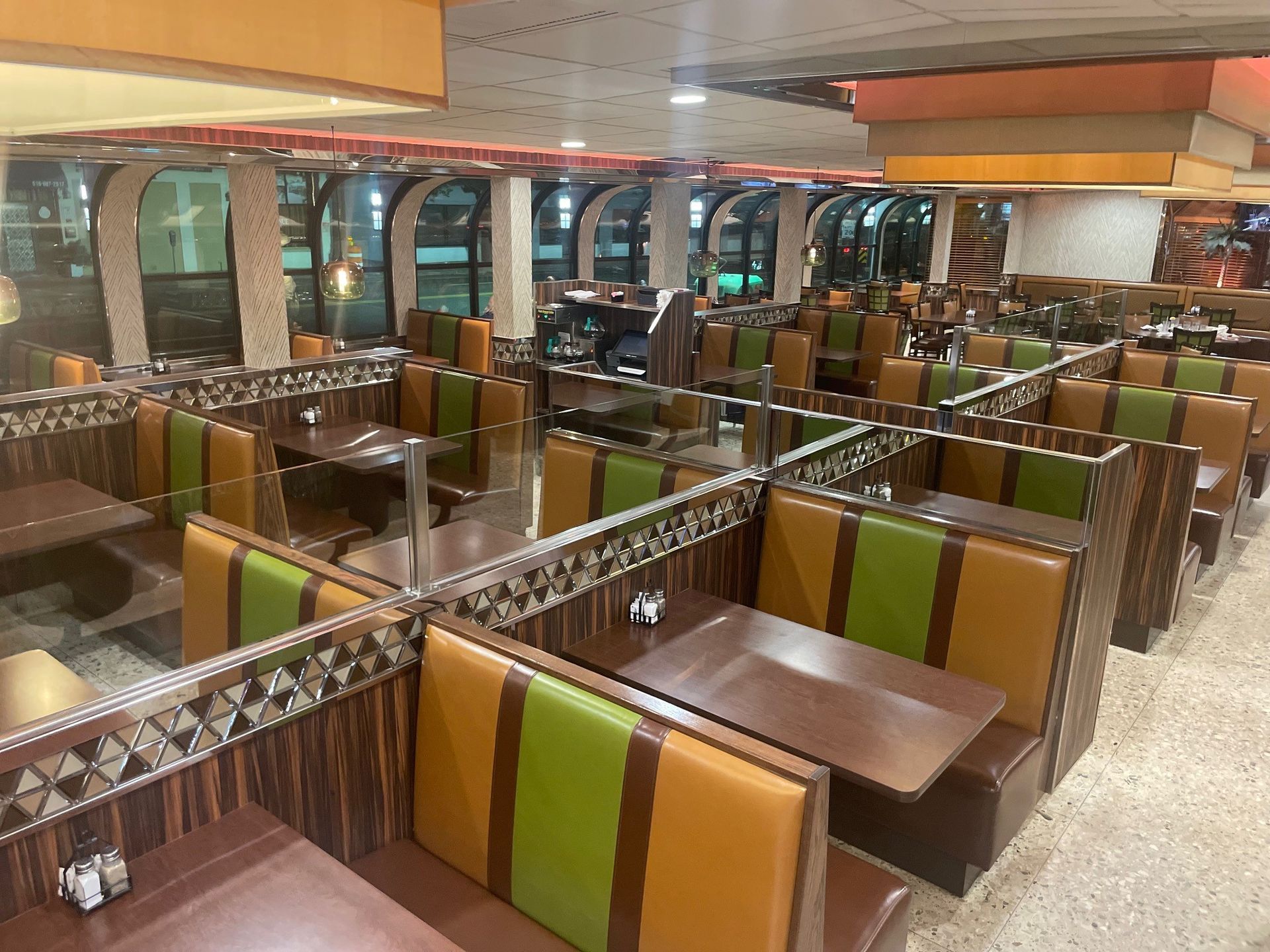 A restaurant with a lot of tables and benches