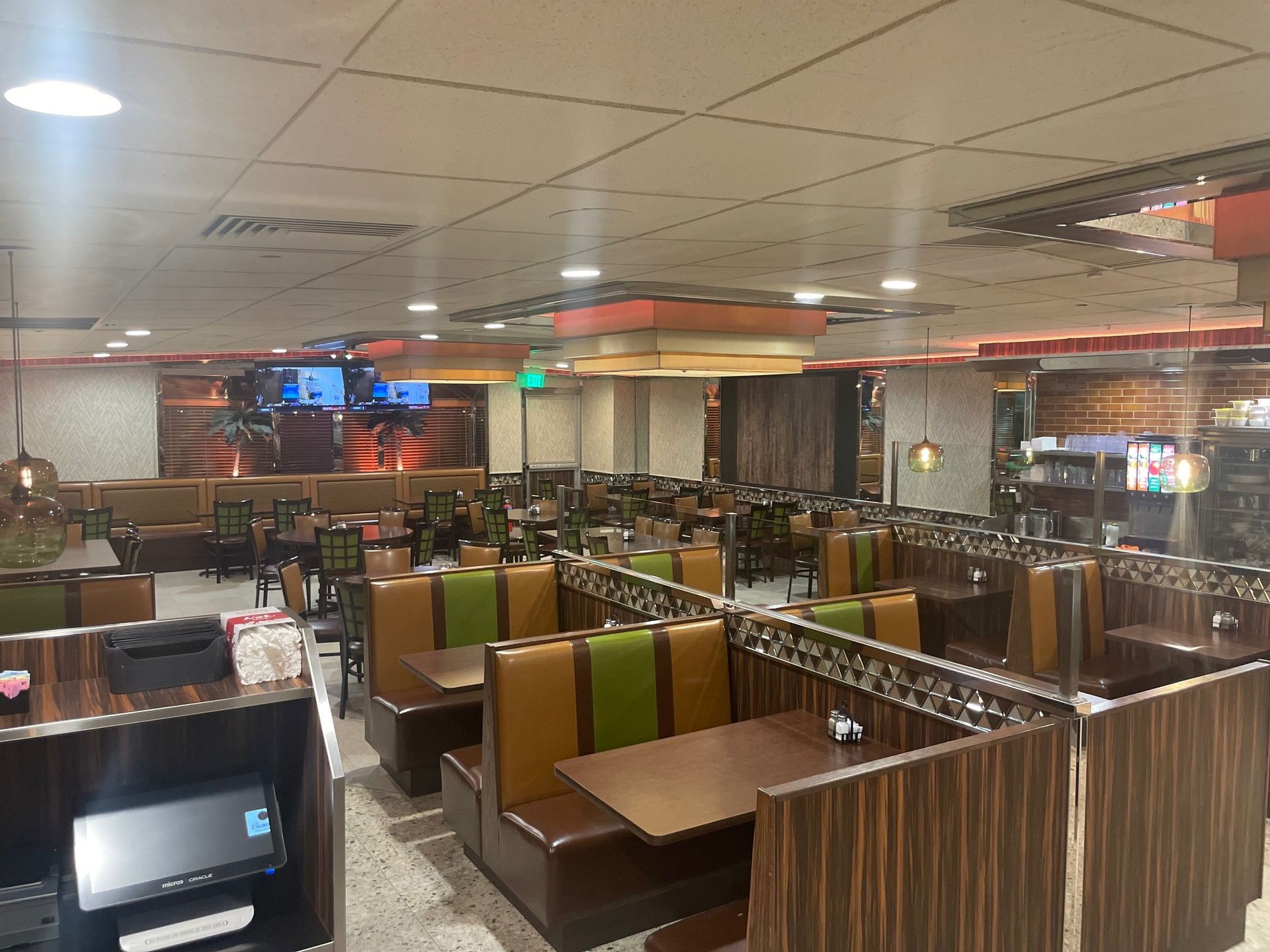 A restaurant filled with tables and chairs and a printer.