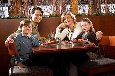 Happy family at the restaurant