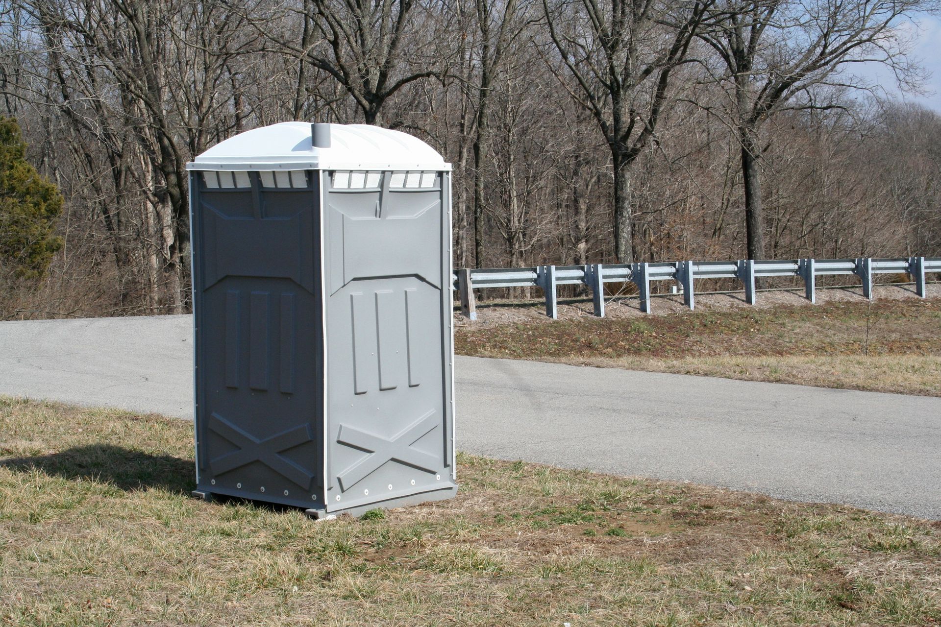 A gray portable toilet