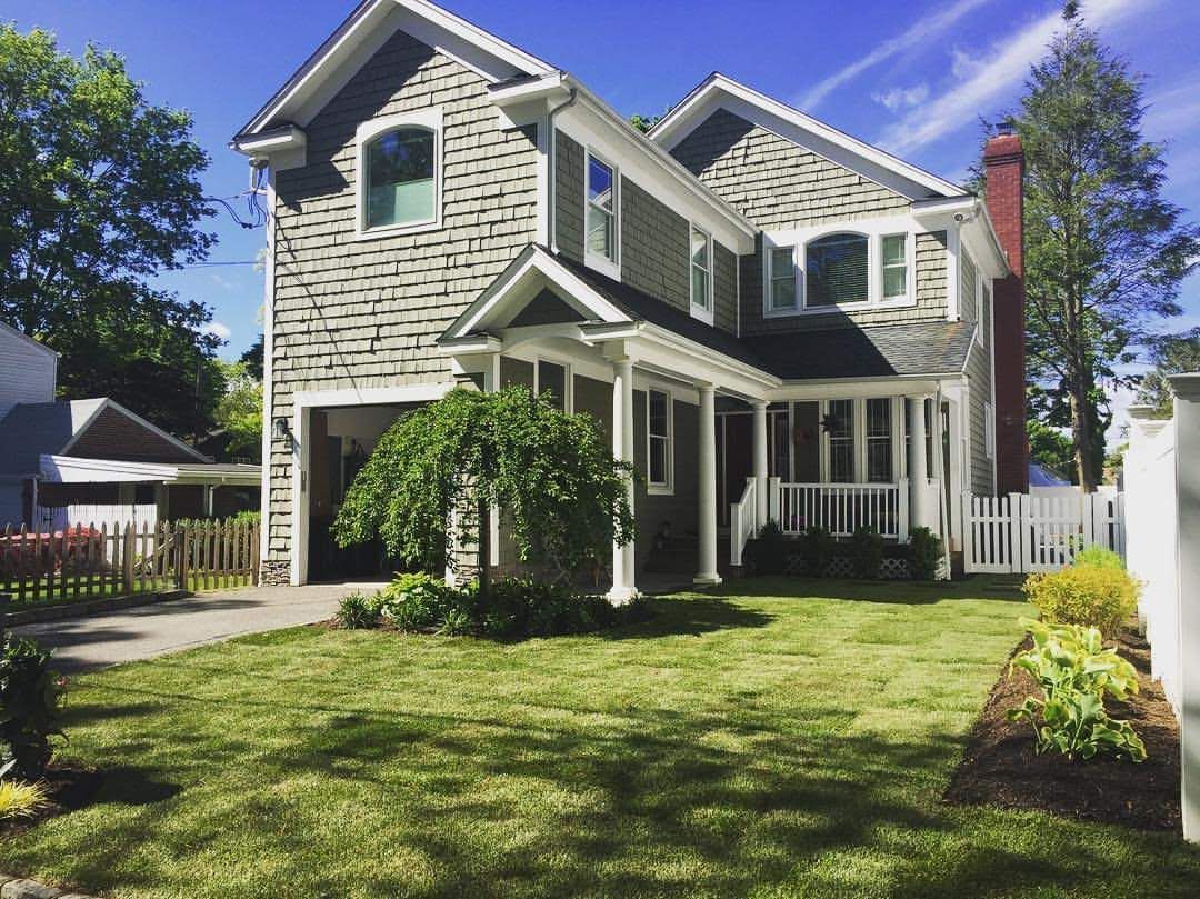 A large house with a large lawn in front of it
