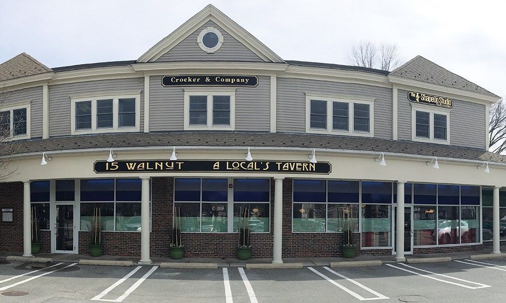A building with a sign that says ' walnut ' on it
