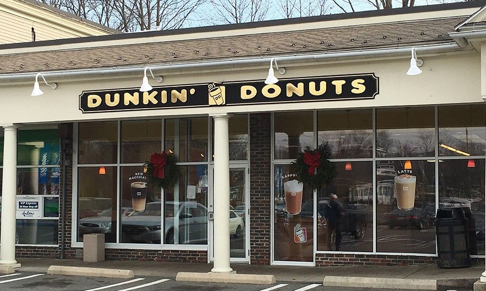 A dunkin ' donuts store with a lot of windows